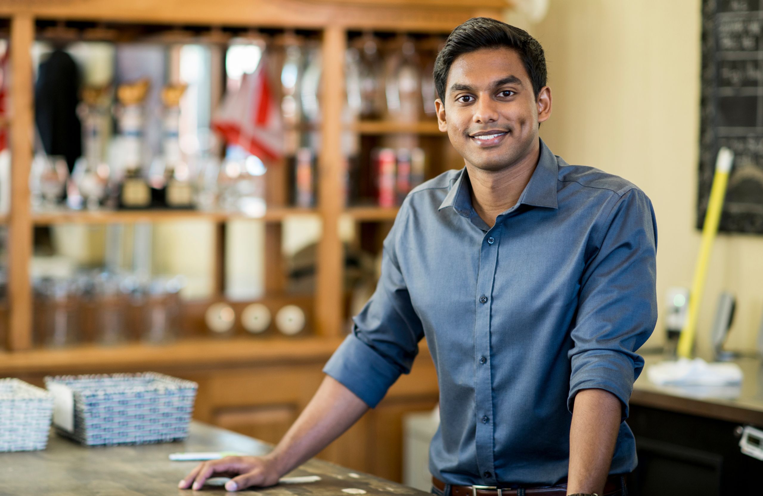 Smiling businessman standing confidently in workplace