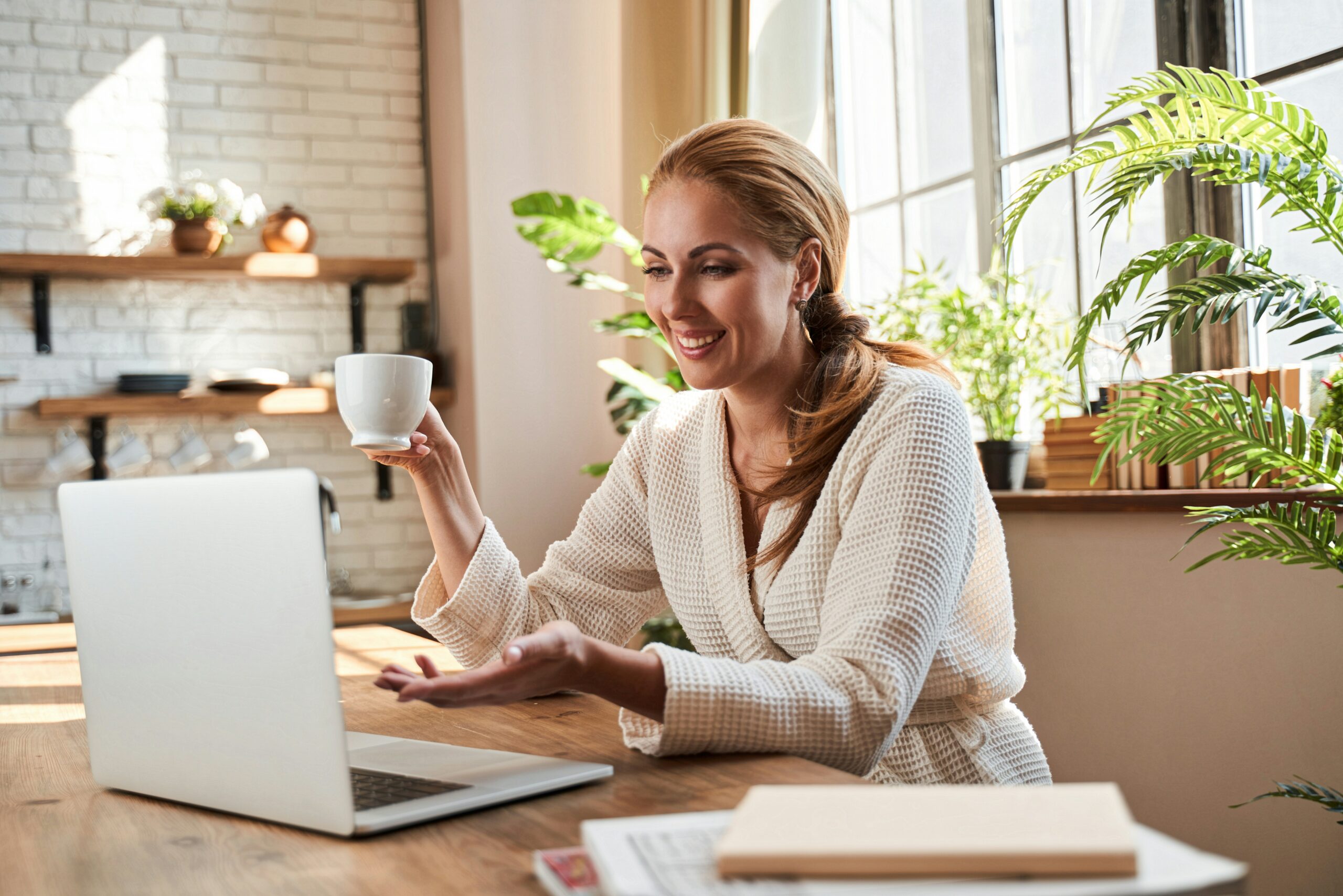 A professional HR manager working on a laptop